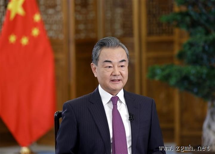 王毅国务委员兼外长就2021年国际形势和外交工作接受新