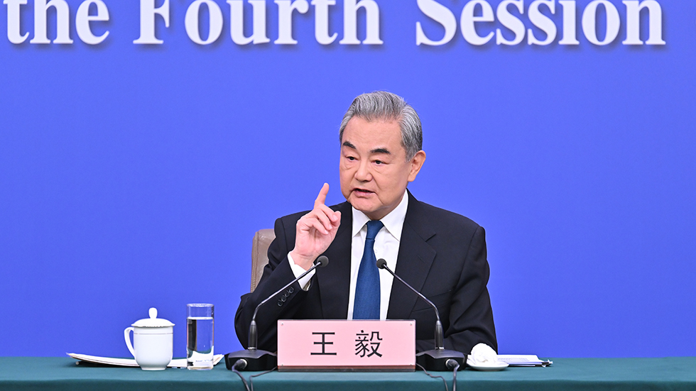 中共中央政治局委员、外交部长王毅就中国外交政策和对外关系回答中外记者提问